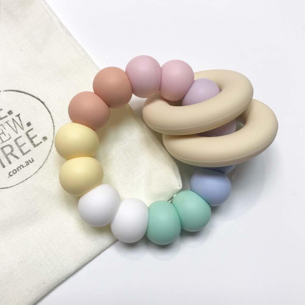One.Chew.Three Gummi Silicone Teether - Pastel Rainbow
