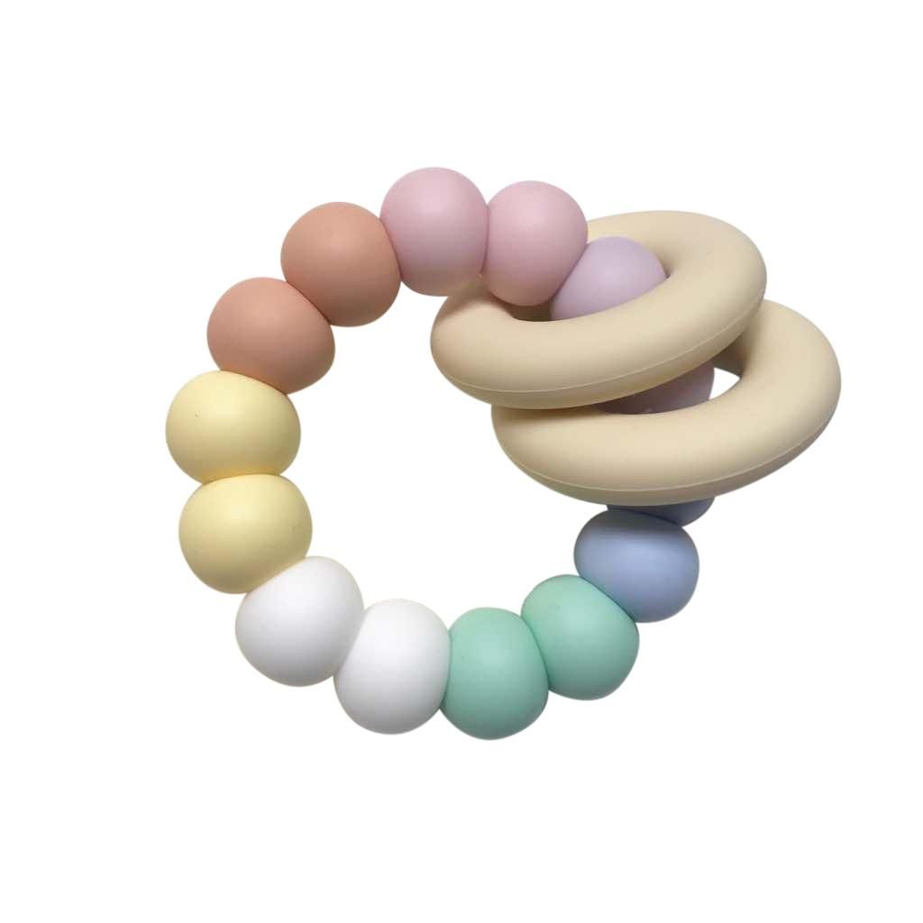 One.Chew.Three Gummi Silicone Teether - Pastel Rainbow