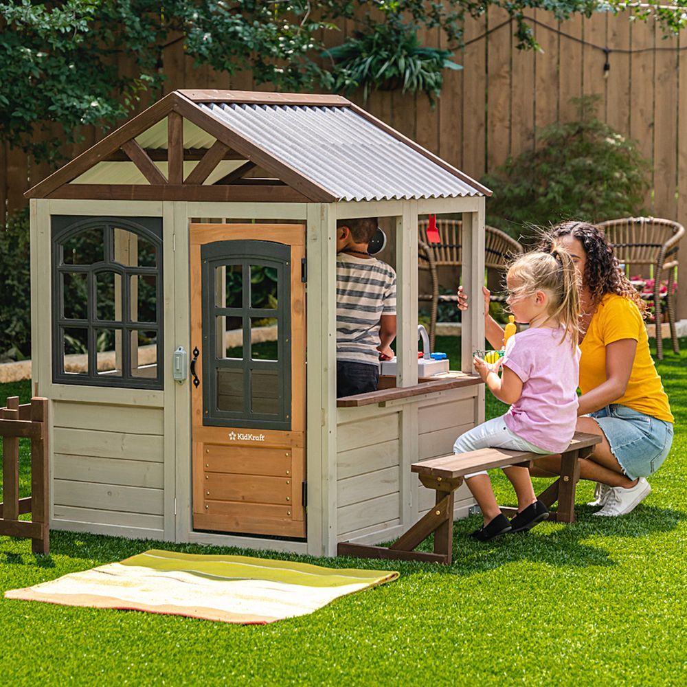 KidKraft Pioneer Cottage Wooden Playhouse - Outdoor Toy for Kids, Playhouse with Porch